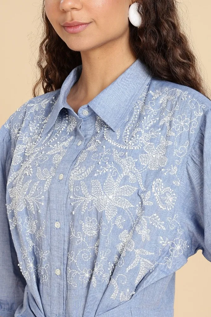 White Thread Embroidery on Blue Shirt